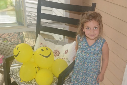 Greta and her smiley balloons